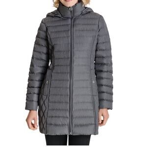 Michael Michael Kors PS Cozy up to this petite puffer coat with a stand collar
